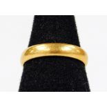 A 22ct gold wedding band, size K, 4g.