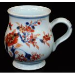 An 18thC Chinese Imari baluster mug with ear handle, predominantly decorated in orange and blue with