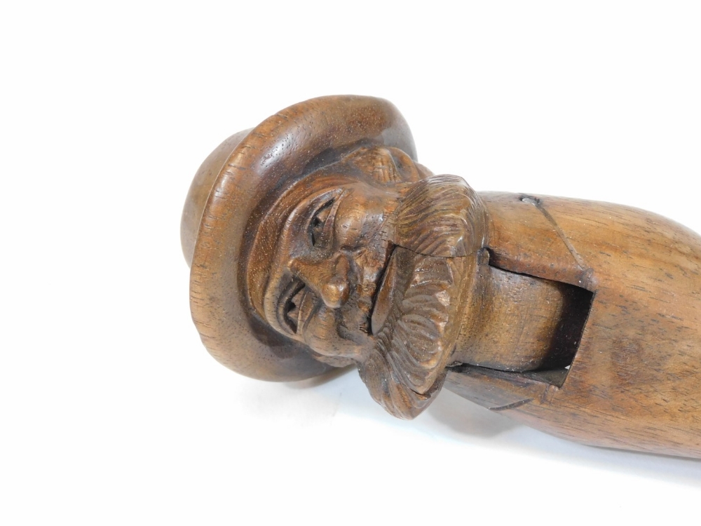 A late 19thC or early 20thC Black Forest nutcracker, the top formed as a bearded gentleman with - Image 2 of 4