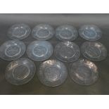 A set of ten Victorian glass ice plates, engraved with a geometric flower within a repeating