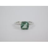 A silver and Tucson green fluorite ring, the cushion shaped stone in a claw setting, 2.48ct, size
