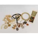 Silver and costume jewellery, including a silver charm bracelet, amber set jewellery, earrings and