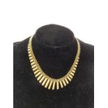 An 18ct gold collar necklace, with a graduated fringe and openwork chain, on a snap clasp, 22.5g.