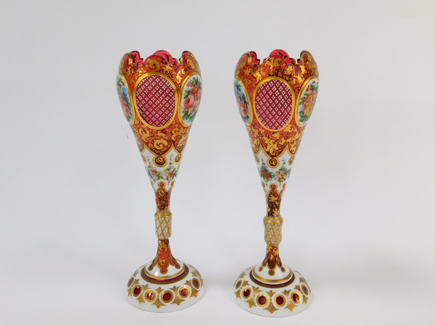 A pair of late 19thC Bohemian flashed cranberry glass vases, of ogee form, raised on a - Image 2 of 5