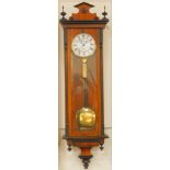 A late 19thC Continental walnut and ebonised Vienna wall clock, circular enamel dial bearing Roman
