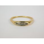A diamond five stone ring, channel set, in yellow metal, approx 1/6th carat, size S, 4.1g.