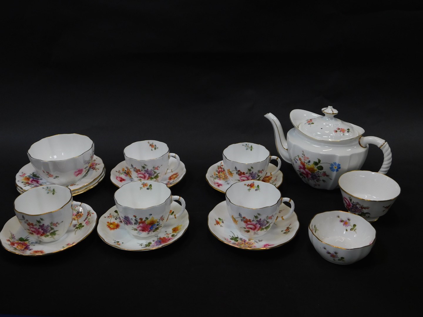 A Royal Crown Derby porcelain part tea service decorated in the Derby Posies pattern, comprising