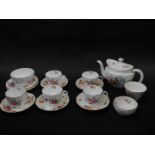 A Royal Crown Derby porcelain part tea service decorated in the Derby Posies pattern, comprising