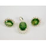 A silver fern green quartz and white topaz pendant and earrings, the oval cut quartz in a surround