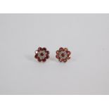 A pair of silver and Mozambrique garnet flowerhead earrings, 2.5ct, with certificate.