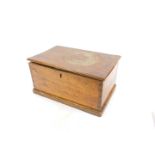 An 18thC elm box, raised on a plinth base, 22cm High, 33cm Wide, 27cm Deep.