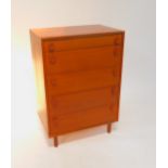A 1960's Merrydew teak chest of one short over four long graduated drawers, raised on turned legs,