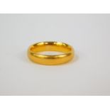 A 22ct gold wedding band, size L, 5.7g.