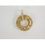 A 9ct gold and diamond Tomas Rae pendant, of circular form. 1.05ct, 2.42g gold, with certificate.