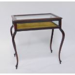 A Victorian oak bijouterie table, the lift out top inset with bevelled glass, with glazed sides,