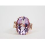 A silver gilt Rose de France amethyst and white topaz Rose Midas ring, the high claw set oval cut