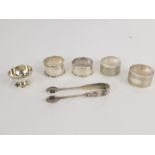 A Mexican silver salt, stamped sterling, and four silver napkin rings, 3.02oz, together with a