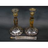 A pair of early 20thC glass candlesticks, with silver resist decoration, 19cm H, together with a