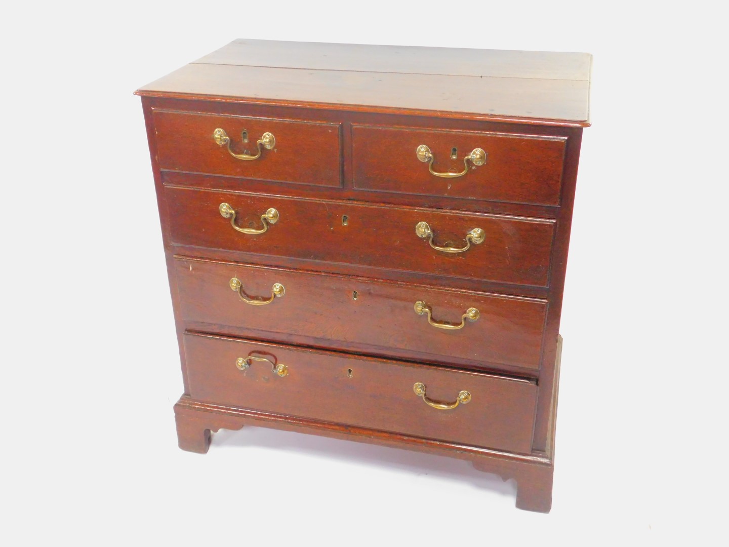 A George II oak chest, of two short over three long drawers, raised on bracket feet, 88cm High, 86cm