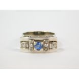 An Art Deco sapphire and diamond ring, in a rectangular claw setting, white metal, possibly 18ct