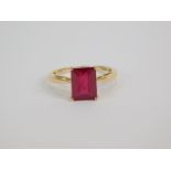 A 9ct gold and ruby solitaire ring, baguette cut, 3.54ct, size N, 1.62g gold, with certificate.