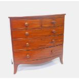 A Georgian mahogany bow front chest, of two short over three long graduated drawers, raised on