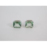 A pair of silver and Tucson green fluorite earrings, cushion shaped in a high claw setting, 6.83cts,