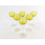 A set of six 20thC French apple green high stem wine glasses, etched with a band of fleur de lys and