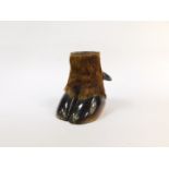A wild boar's cloven hoof stand, hollowed out, 17.5cm high.