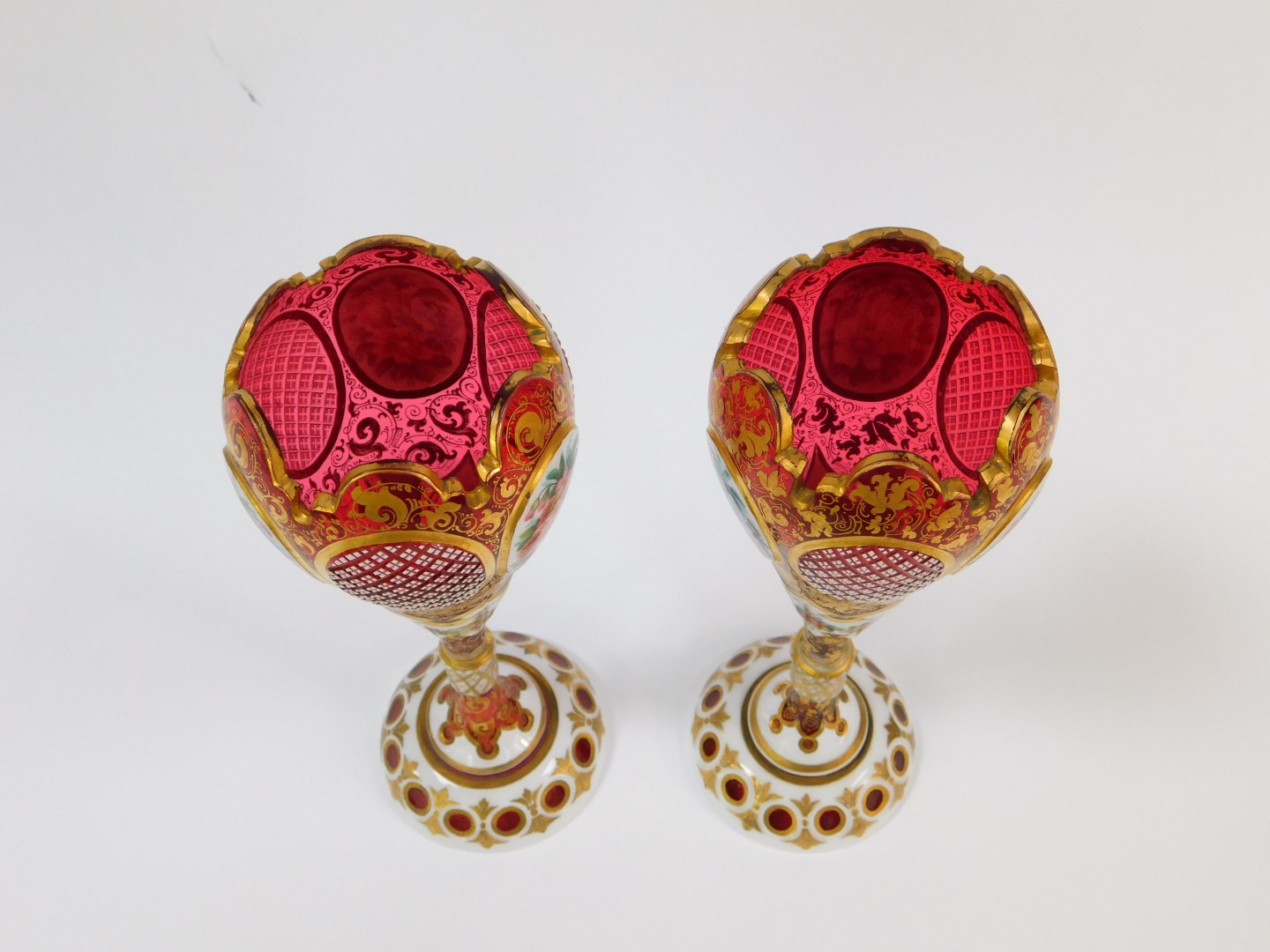 A pair of late 19thC Bohemian flashed cranberry glass vases, of ogee form, raised on a - Image 3 of 5