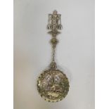 A Dutch silver spoon, with pierced and repousse decoration, the terminal decorated with a milk