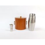 A vintage late 20thC teak cylindrical ice bucket, together with a cocktail shaker and a jigger. (3)