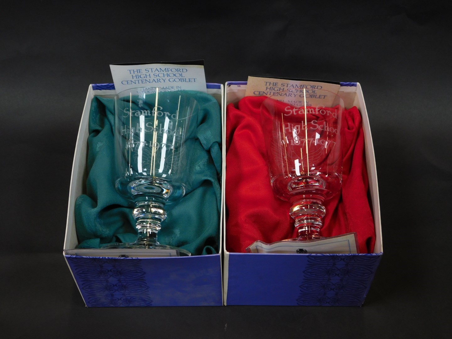 A pair of Wedgwood cut glass Stamford High School Centenary goblets, etched Stamford High School