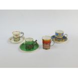 Four early 20thC porcelain demi-tasse coffee cans, with silver holders, three with saucers,