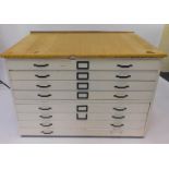 A painted pine two sectional plan chest of eight drawers, 82cm H, 123.5cm W, 88cm D.