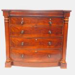 A Victorian Scottish flame mahogany bow front chest, of two short over three long drawers, with