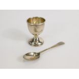 A silver egg cup and spoon, Birmingham 1954, 1.28oz.