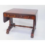 A William IV mahogany sofa table, with two frieze drawers, raised on square and fluted scroll