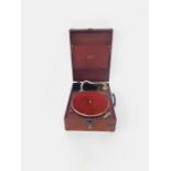 A Sackville Deluxe red cased table top gramophone, 30cm wide, 40cm deep