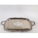 A Walter Trickett silver plated twin handled tray, with engraved foliate decoration within a
