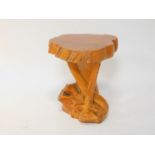 A carved driftwood stool or occasional table, 58.5cm H, 43cm Dia.