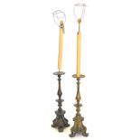 A pair of continental brass standard lamps, each modelled in the form of Italian church candlesticks