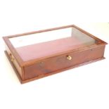 A mahogany table top display cabinet, with a glazed top and sides, a red velvet lined interior and