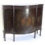 An early 20thC mahogany side cabinet in Chippendale style, the bow fronted top with a moulded edge