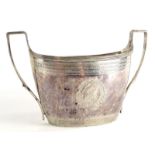 A George IV silver two handled sugar bowl, with engine turned bands, a central leaf cartouche