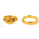 A Victorian gold wedding band with inscription, unhallmarked, 4.5g and an interlinked serpent