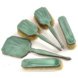 An Asprey Art Deco silver part dressing table set, with green guilloche enamel decoration to each