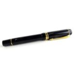 A Parker Duofold fountain pen in black, with gold plated bands, the nib stamped 18K 750.