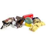 A collection of items, to include a tribal type bag or purse, decorated overall with various shells,