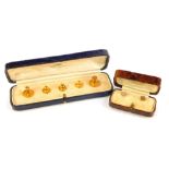 Two cased sets of shirt studs, 9ct gold, but with a single 18ct, 5.8g all in.